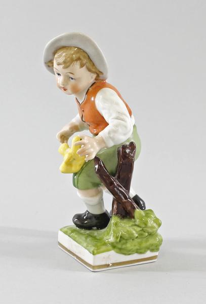 Junge mit Küken